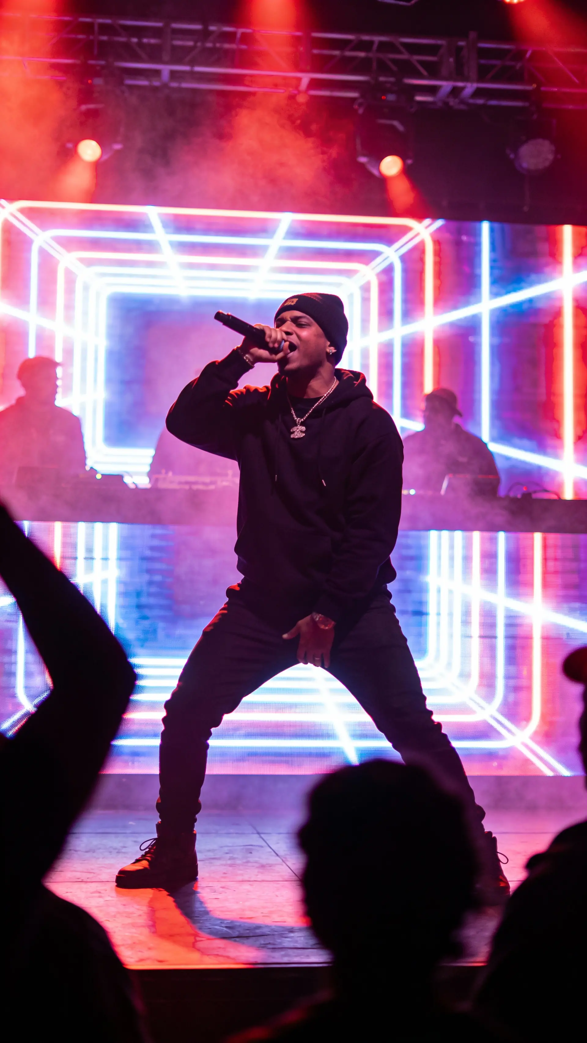 Dynamic Rapper Performance on Stage with LED Screens